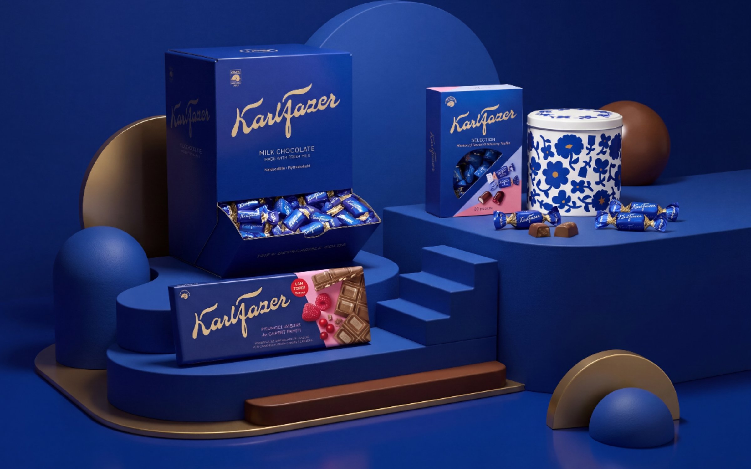 Karl Fazer chocolate product range styled on a sculptural blue and gold set