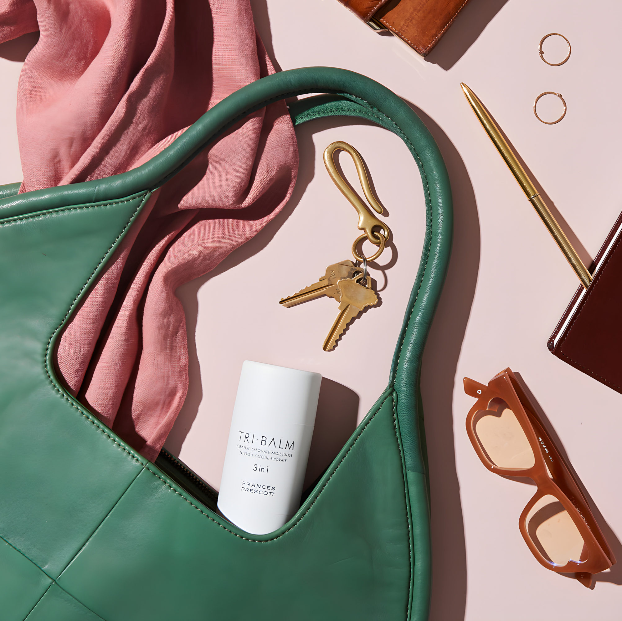 Formulae Prescott — Tri-Balm styled in a handbag flat-lay