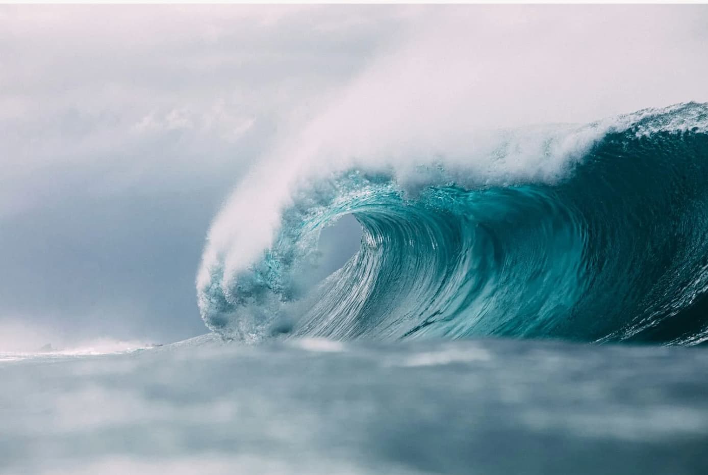 A powerful ocean wave captured in mid-motion, representing the changing tides, creative momentum, and the "seasons of becoming" in the journey of artist Jalita S. Aspelin.